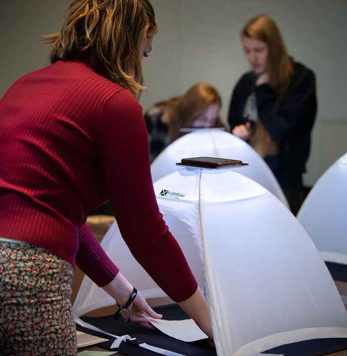 Person uses Scan Tent to make scans of heritage materials